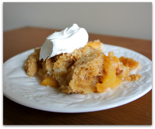 Easy peach cobbler recipe made in the slow cooker. Don't forget to top with whipped cream!