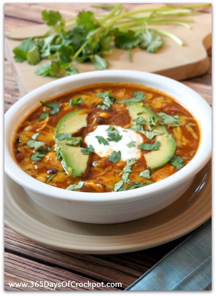 Slow Cooker Chicken Enchilada Soup–all the flavors of chicken enchiladas in a bowl of soup. The soup is thickened up with a can of refried beans instead of dairy…this soup can be made dairy free if you want it to be. This version is made in your slow cooker.