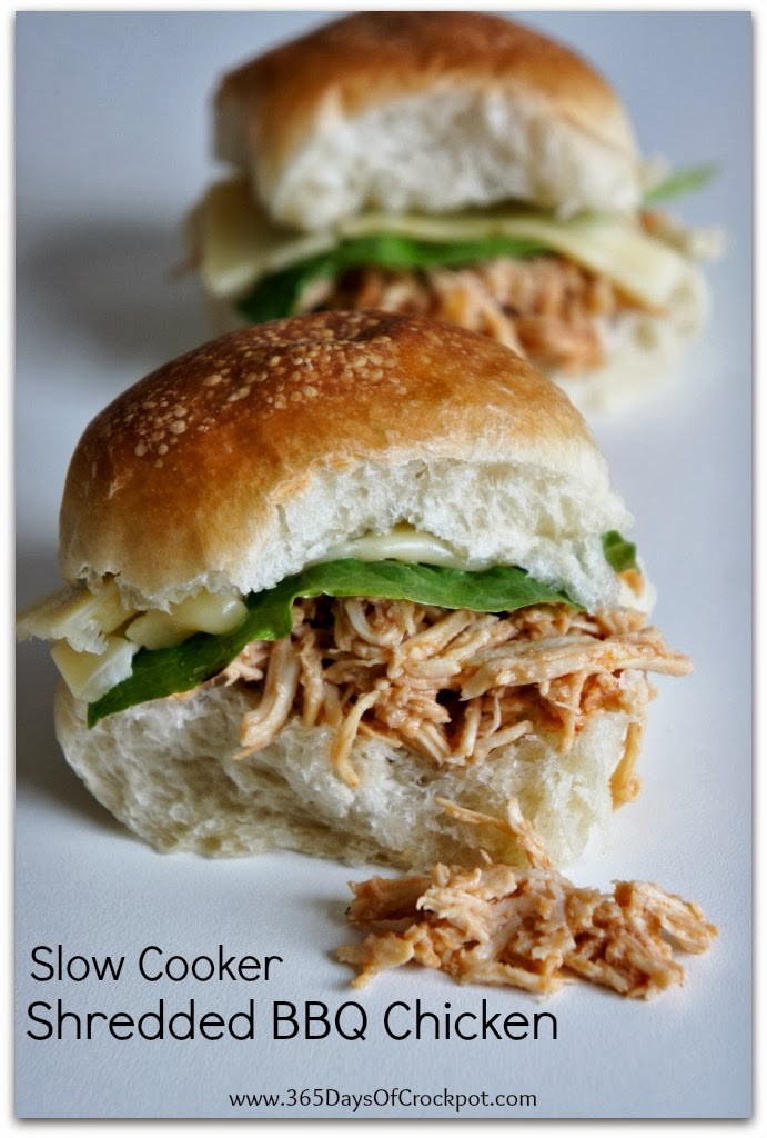 An easy 5 ingredient recipe for Slow Cooker Shredded BBQ Chicken.  Serve the tender meat on slider buns, salad or even pizza!  Easy dinner that the whole family will love.  #crockpot #slowcooker 