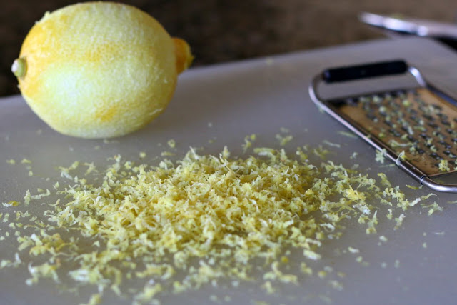 zesting a lemon with a cheese grater