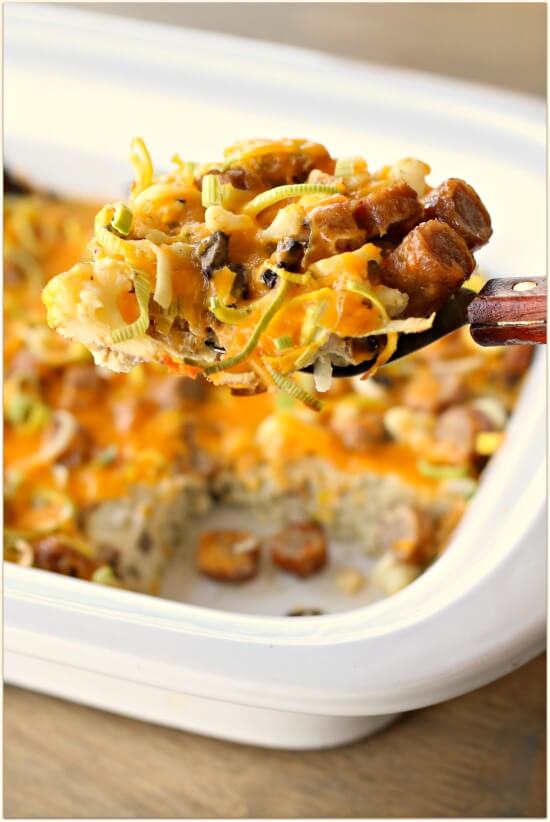 A savory, low carb breakfast casserole made in the slow cooker with eggs, cauliflower, leeks, mushrooms, sausage and shredded sharp cheddar cheese. 