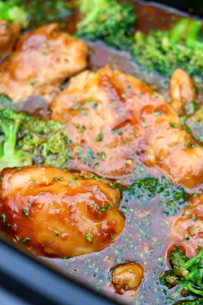 Slow Cooker Honey Garlic Chicken--an easy Asian crockpot recipe for tender chicken thighs in a lemon, soy sauce, honey and garlic sauce.