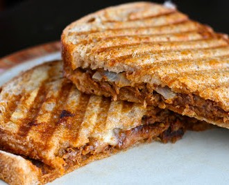 Slow Cooker Pulled Pork Paninis with Caramelized Onions and Homemade BBQ Sauce