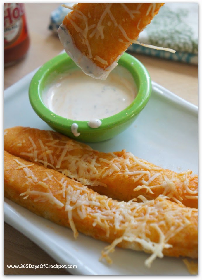 Super easy and FAST recipe for breadsticks that are coated in buffalo sauce and melty parmesan cheese.  Super addicting!