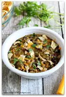 Lentils and chicken are slow cooked with green salsa and black beans to make a creamy one pot dinner. Top it with cheddar, sour cream, cilantro and crunched up tortilla chips for the ultimate Mexican meal