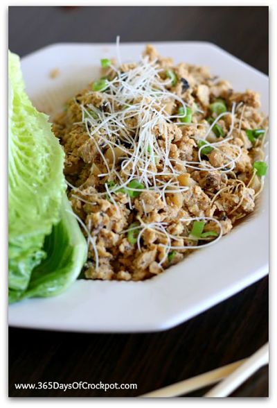 Slow Cooker PF Chang's Lettuce Wraps: Ground chicken, mushrooms, green onion, water chestnuts and crispy rice sticks all rolled up into crisp leaves of lettuce.