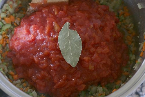 add in petite diced tomatoes and a bay leaf--tomato soup recipe