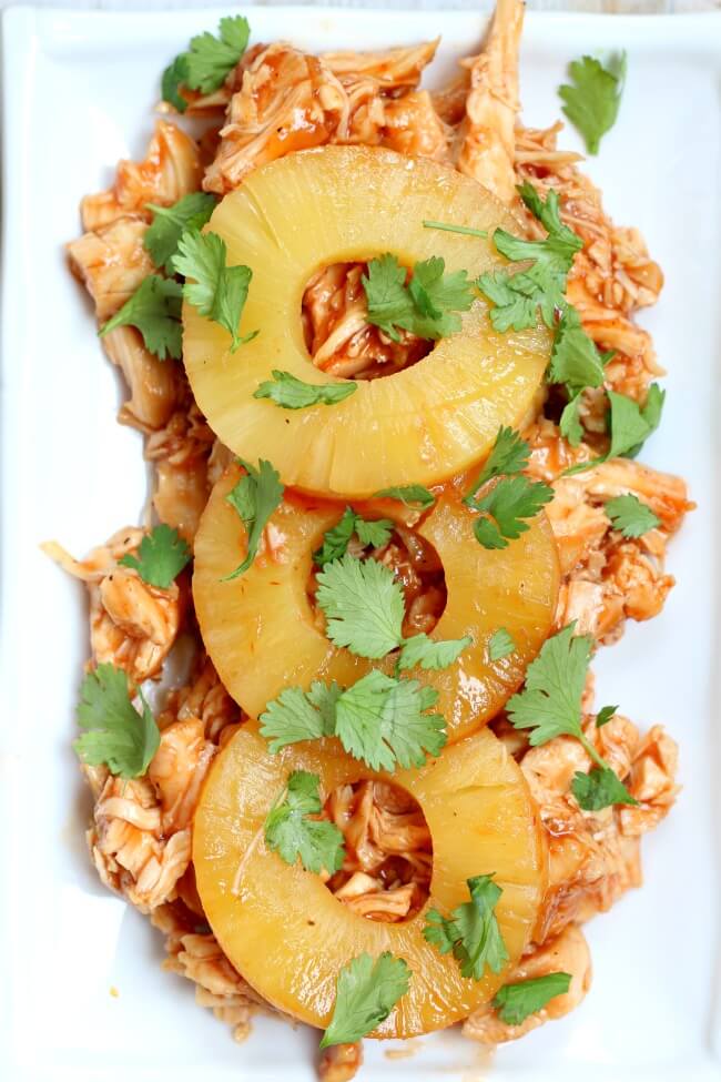 Instant Pot Hawaiian Chicken--a super fast and easy, 4-ingredient, dump and go Instant Pot recipe of slightly sweet chicken and pineapples. Serve this chicken on Hawaiian rolls or over rice. 