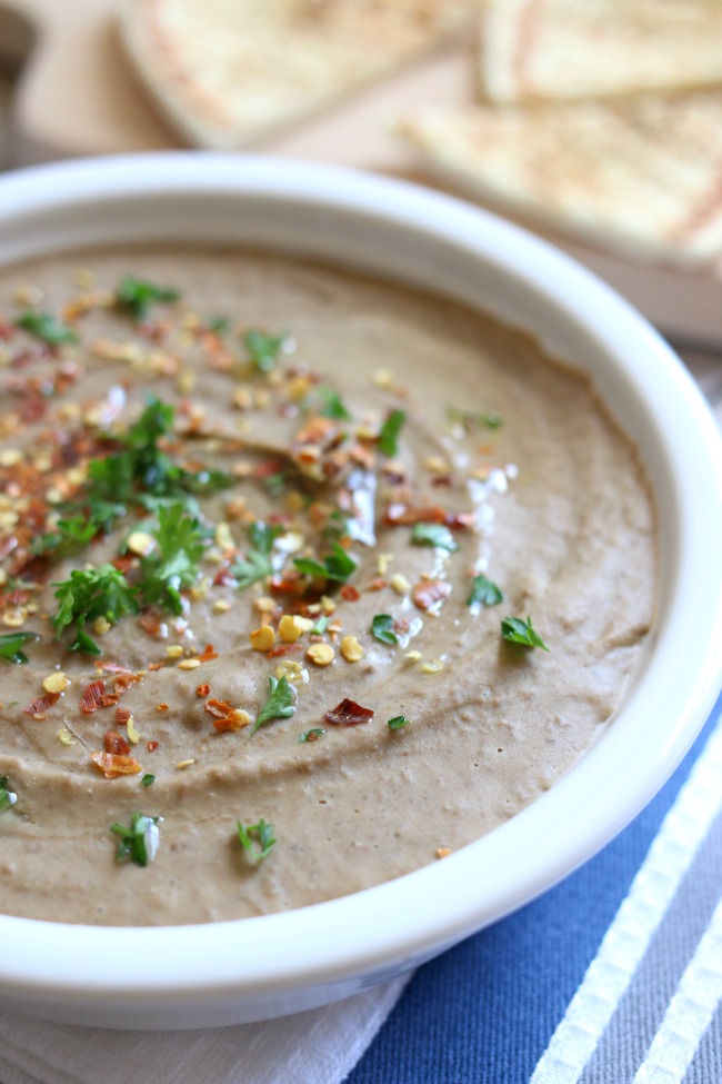 Slow Cooker Lentil Hummus--Make your own garlic lentil hummus at home in your slow cooker. It is super easy to make and a perfect healthy snack. 