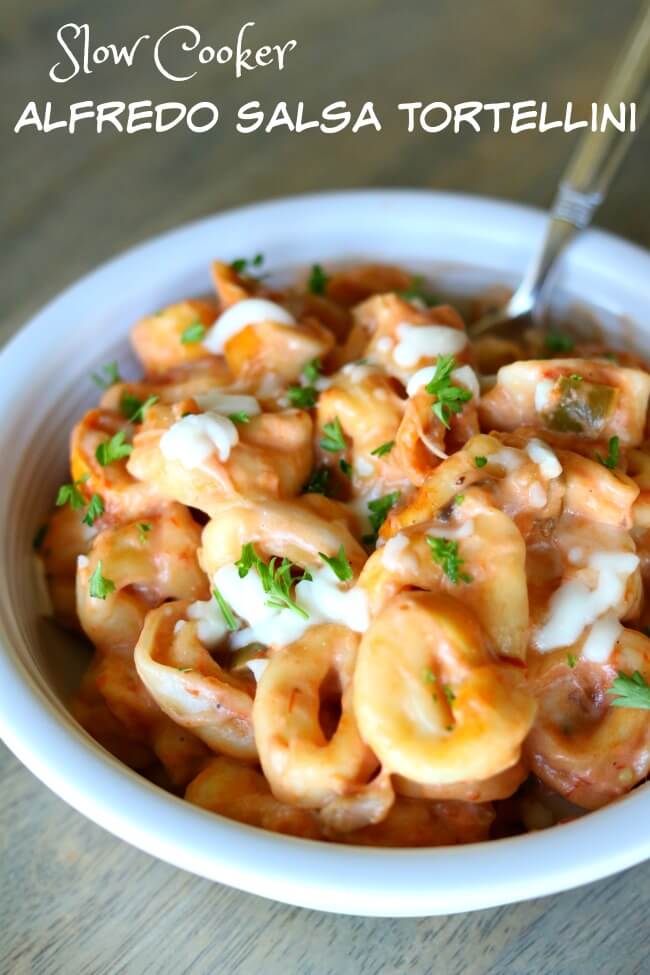 Slow Cooker Alfredo Salsa Tortellini--creamy and slightly spicy cheesy tortellini prepared in about one minute using your slow cooker. 