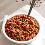 Homemade Slow Cooker Pork and Beans: your childhood favorite pork n' beans made at home in your slow cooker with dried beans and lots of crispy bacon and just a couple other pantry staples.