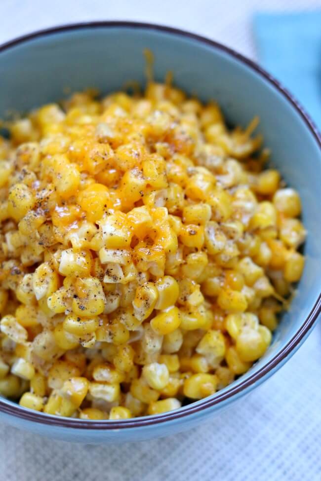 Slow Cooker Cheesy Creamed Corn: an easy slow cooker recipe for a indulgent, cheesy and creamy corn dish that is perfect for a special holiday meal. 