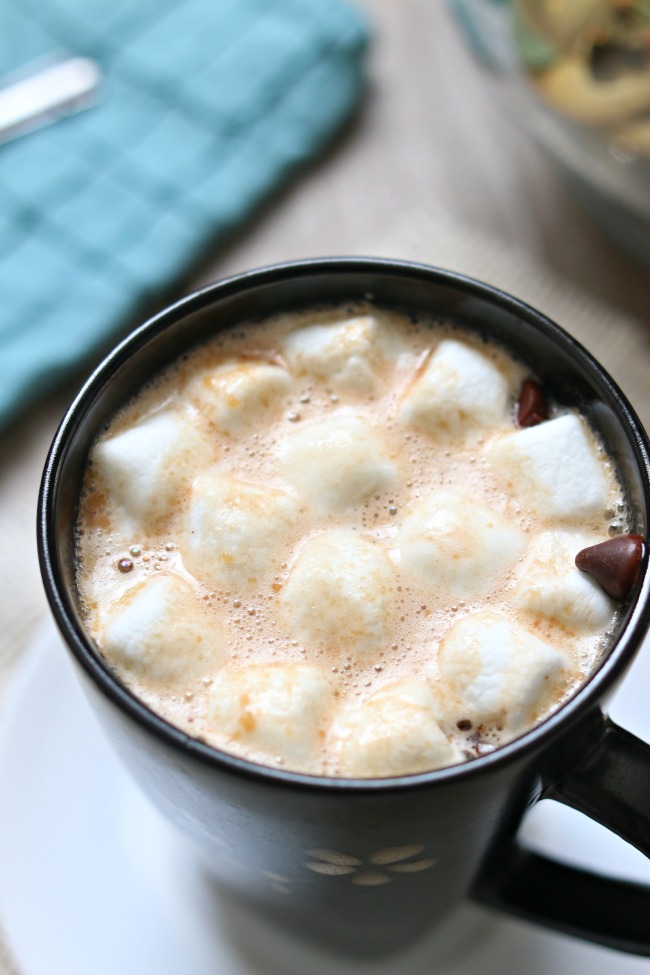 Slow Cooker Peanut Butter Hot Chocolate--chocolate and peanut butter are made for each other and they make a perfect creamy combination in this homemade crockpot peanut butter hot chocolate recipe. 