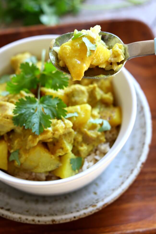Slow Cooker Yellow Chicken Curry: a thai-style coconut curry with moist bites of chicken, tender bites of yellow potatoes, vibrant turmeric and curry powder all made easily at home in your slow cooker. 