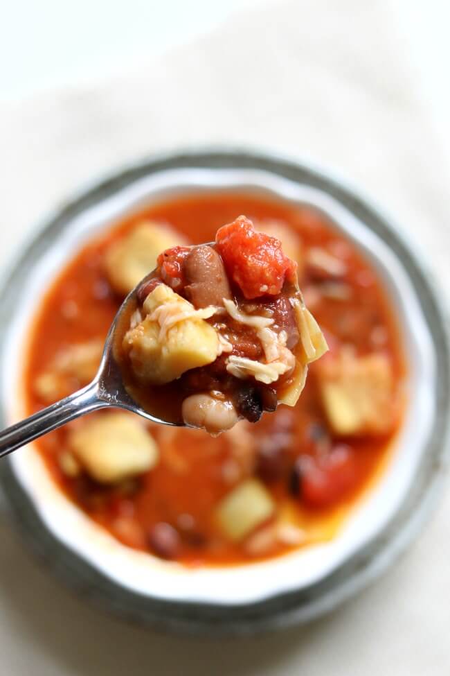 Tomato Artichoke 15-Bean Soup--a healthy soup with crushed tomatoes, tender fleshy artichoke hearts, a variety of hearty beans, Parmesan cheese and seasoned croutons. 