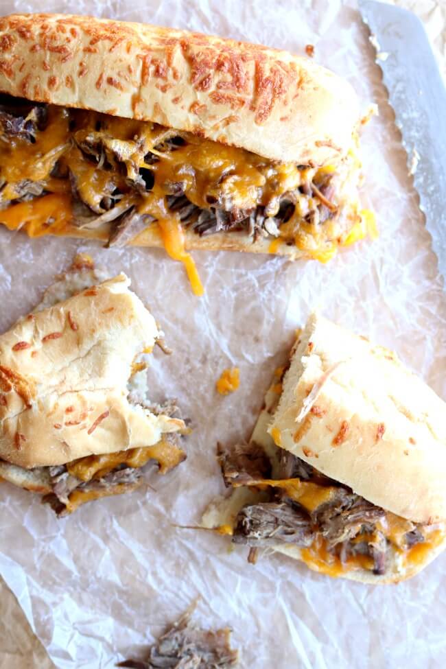 Slow Cooker Beef and Cheddar Sandwiches--the easiest recipe to make ever. With only 4 ingredients total (beef, onion soup mix, cheddar and sandwich buns) you may be thinking that this recipe is just too easy to taste good. Well, you're wrong :) The flavor is amazing and your family will be asking for seconds.