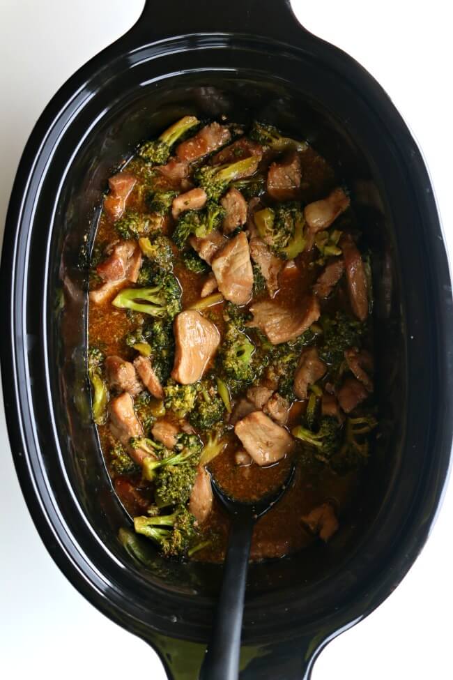 Slow Cooker Pork and Broccoli--you've heard of Asian beef and broccoli but I'm mixing it up today by using pork sirloin instead. This gluten free crockpot recipe is super easy but it will make you feel like you're eating at your favorite Chinese restaurant. Tender pieces of pork and a super savory sauce with semi-cooked broccoli all go together nicely over white rice. 