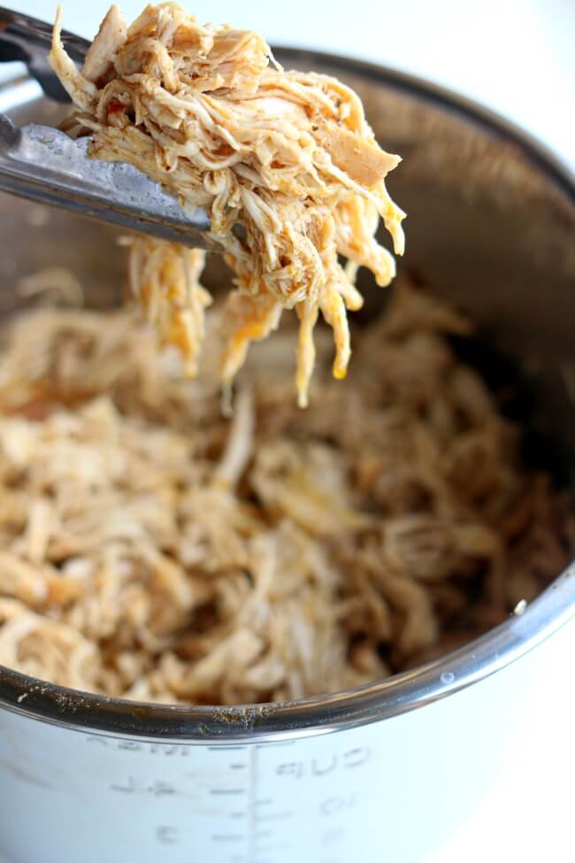 Instant Pot Café Rio Chicken–this quickly cooked shredded chicken is perfect to serve with your Mexican dinners on salads, in burritos, in enchiladas or over rice.