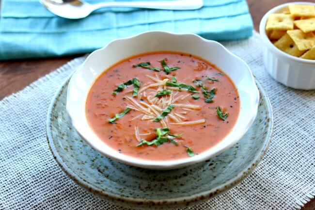 Instant Pot Tomato Basil Parmesan Soup-- a creamy tomato based soup that is made from start to finish in 45 minutes thanks to the help of your pressure cooker. This is my favorite soup to make for company. I always get tons of compliments. I don't believe I've tasted soup at a restaurant that is as good as this version. 