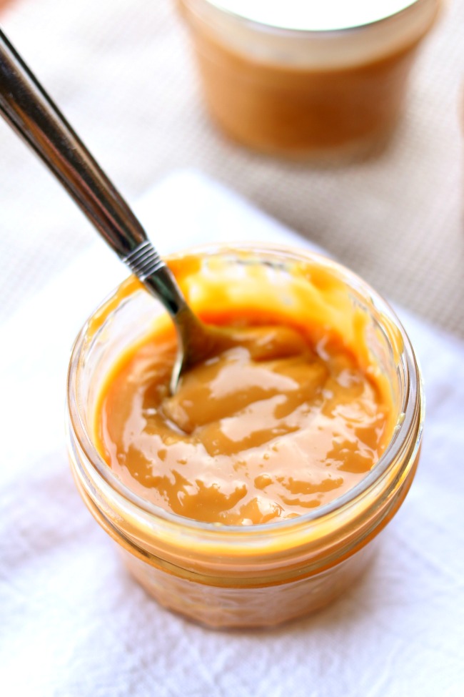 Instant Pot Caramel Dipping Sauce (Dulce De Leche)--if you're a fan of all things sweet and caramelly you're going to love this dulce de leche that is a perfect dipping sauce for apples or to pour over ice cream. The best part is that all you need is your electric pressure cooker and a can of sweetened condensed milk. 