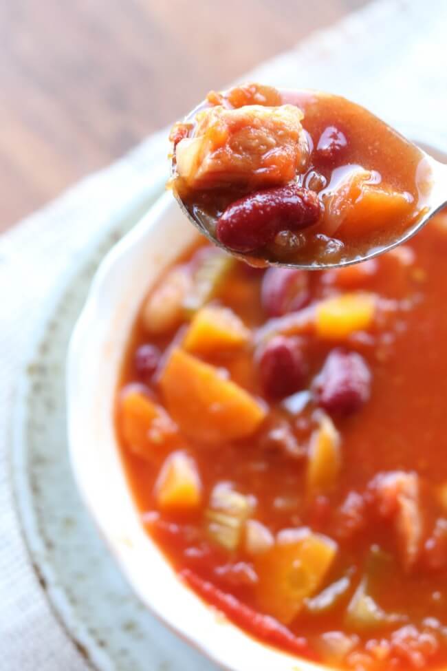 Instant Pot (Tomato Based) Ham and Bean Soup--a healthy and quick soup recipe that's full of bright flavor thanks to crushed tomatoes and fresh lemon juice. A perfect way to use up leftover ham.