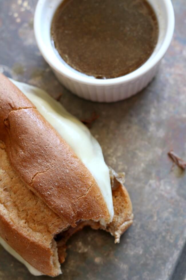 Instant Pot French Onion French Dip Sandwiches--The French dip sandwich is a hot beef sandwich consisting of tender thin slices of beef layered a long white French roll that is dipped into a flavorful sauce made from the pan juices. It is a staple at any diner in America. My recipe is a mash-up between French Onion Soup and the French Dip Sandwich. Soft onions are piled along with the beef and cheese on a crusty roll.