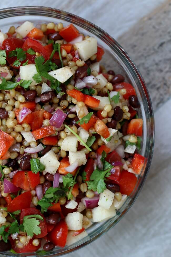 Instant Pot Colorful Wheat Berry Salad--The perfect summer salad for all picnics, potlucks and barbecues. Wheat berries with a lime dressing, black beans, avocados, grape tomatoes, red peppers, jicama, red onion and cilantro. It's got the crunch, the chewiness and the bright flavors all in one salad. 