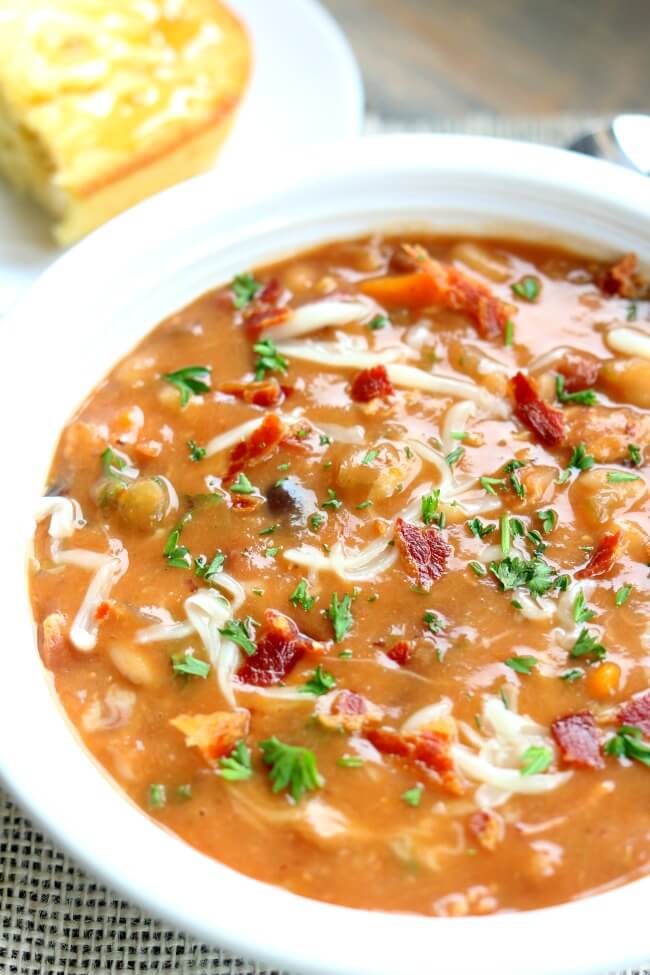 Slow Cooker Bean and Bacon Soup--dried beans are cooked all day in your slow cooker along with carrots, celery, garlic and bacon. A simple but seriously delicious soup that will leave you wanting seconds (and the leftovers the next day are even better than the first day). 