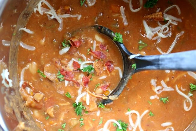 Instant Pot Bean and Bacon Soup--dried beans are cooked quickly in your electric pressure cooker along with carrots, celery, garlic and bacon. A simple but seriously delicious soup that will leave you wanting seconds (and the leftovers the next day are even better than the first day). 