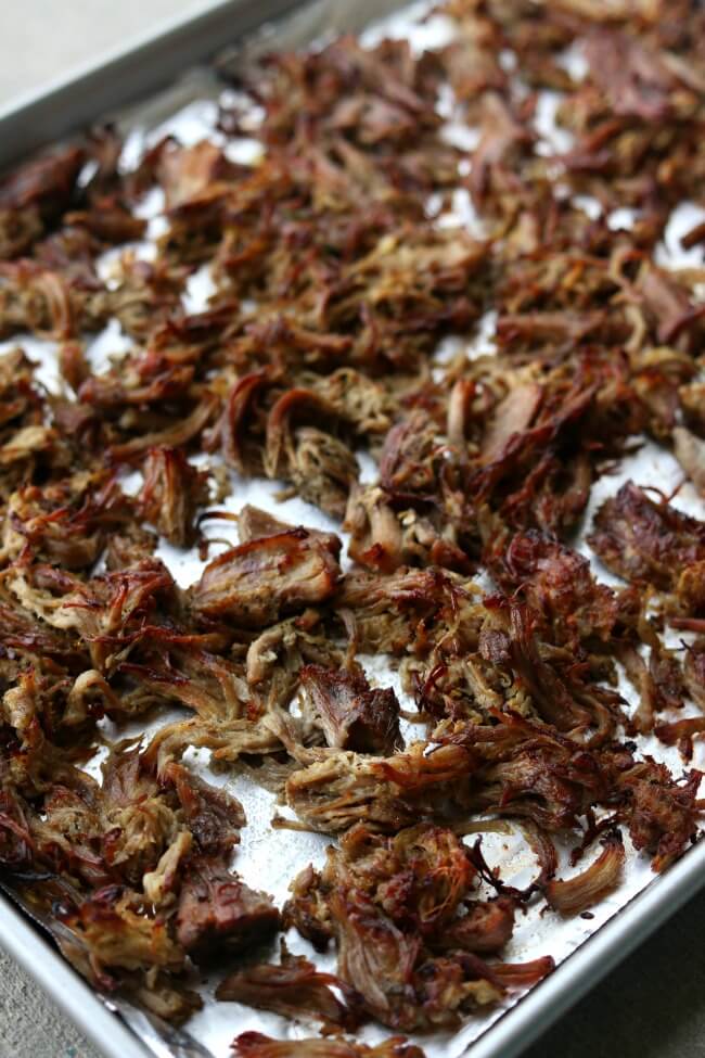 Instant Pot Crispy Pork Carnitas--pork is cooked until tender in your Instant Pot with onion, garlic, jalapeno, and lots of spices. Then the pork is crisped up under the oven broiler to create maximum flavor and texture for tacos, salads, burritos, nachos and enchiladas. 