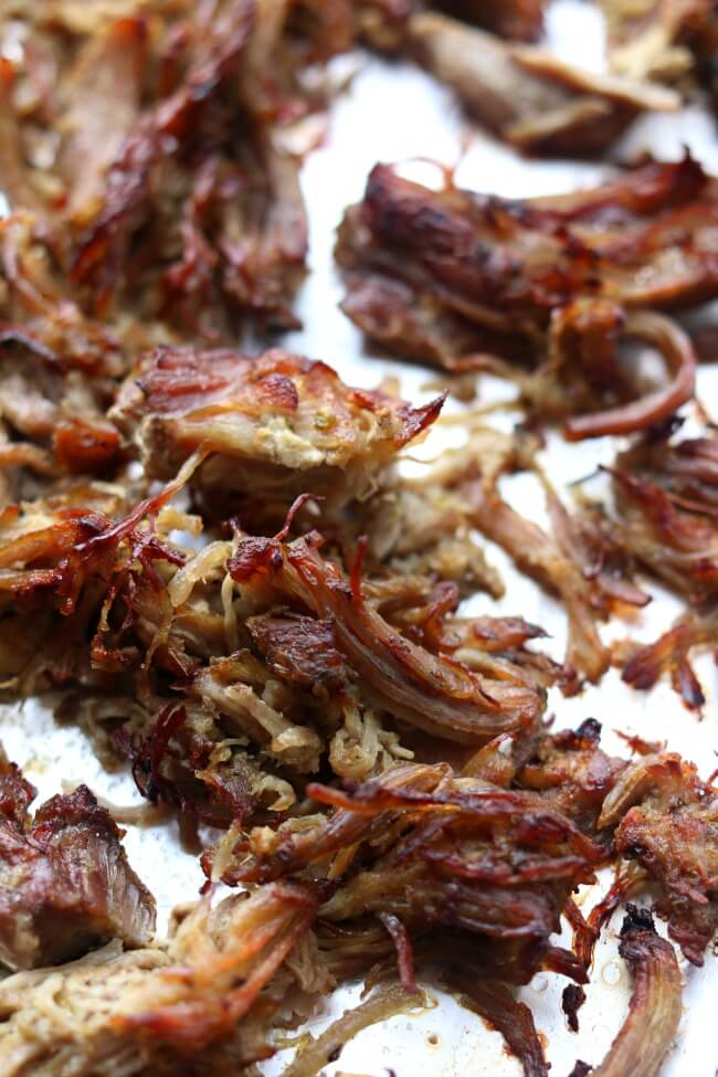Instant Pot Crispy Pork Carnitas--pork is cooked until tender in your Instant Pot with onion, garlic, jalapeno, and lots of spices. Then the pork is crisped up under the oven broiler to create maximum flavor and texture for tacos, salads, burritos, nachos and enchiladas. 
