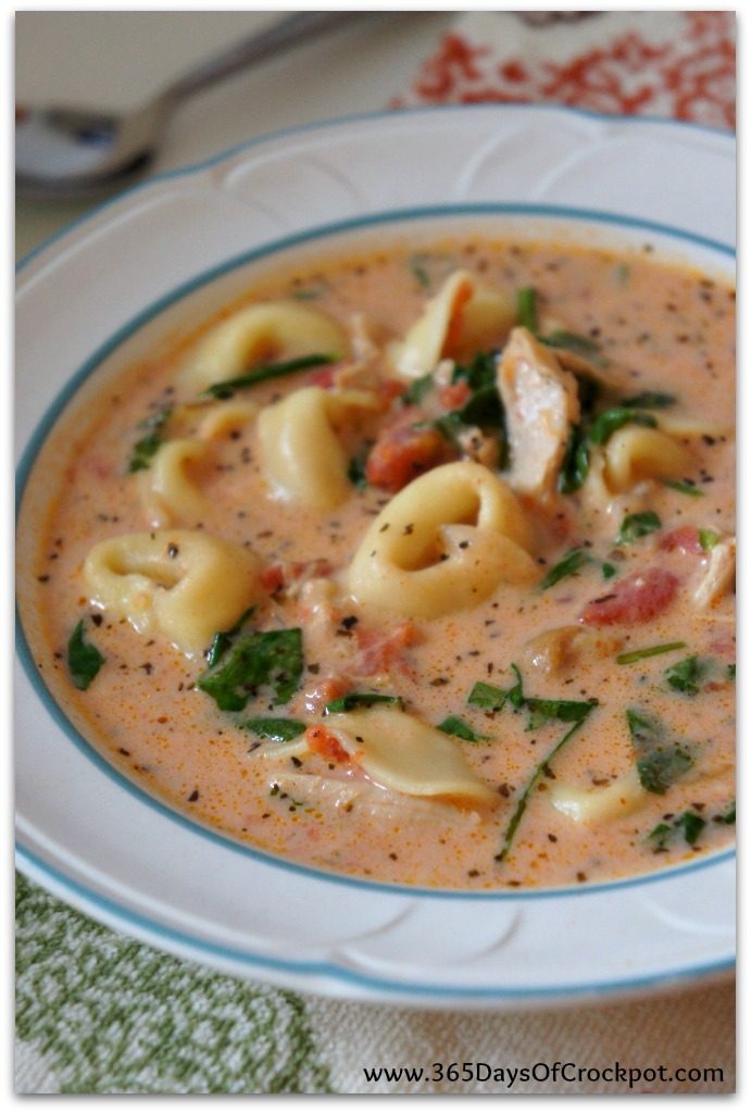Instant Pot Creamy Tortellini, Spinach and Chicken Soup--creamy tomato based soup with bites of tender chicken, cheesy tortellini and fresh bright green spinach. This version is made in the electric pressure cooker and is a quick and easy one pot meal. Everyone in my house loves this soup and I love making it for friends too. I've never heard a complaint when I've made this soup!