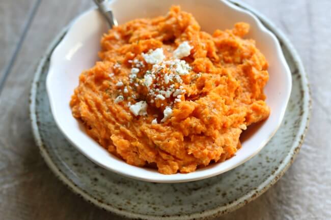 Slow Cooker Feta Dill Sweet Potato Mash--creamy mashed sweet potatoes made with garlic, feta and dill for ultimate flavor. This side dish frees up your oven and stove since it's made in the slow cooker. 