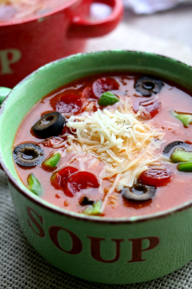 Instant Pot Pizza Soup--Love pizza?  Try this soup that tastes like the real deal (minus the crispy crust).  It’s made in the pressure cooker too so it’s extra fast and totally delicious.  Add whatever pizza toppings you like to the soup to make it taste even better! 