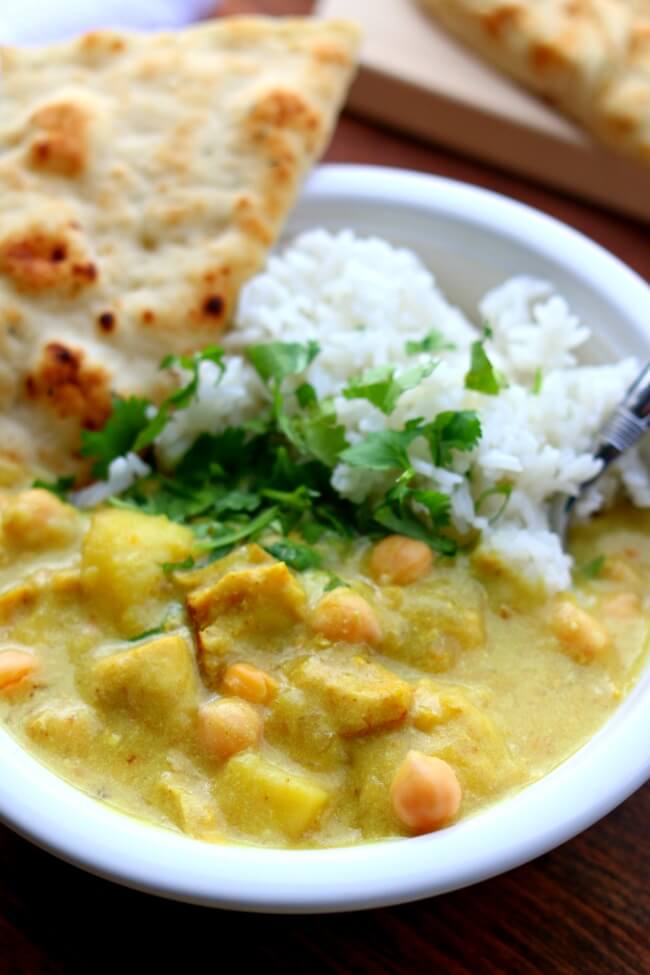 Instant Pot Yellow Chicken Curry and Jasmine Rice--a thai-style coconut curry with moist bites of chicken, tender bites of yellow potatoes, vibrant turmeric and curry powder all made quickly at home in your electric pressure cooker. Bonus: The jasmine rice is cooked at the same time and in the same pot!