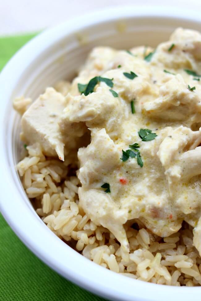 Slow Cooker Creamy Chicken: the easiest cheater recipe out there. Chicken, cream cheese, cream of chicken soup and an Italian dressing mix packet are combined to make a delicious chicken and rice dinner with hardly any work.