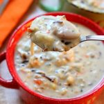 Instant Pot Creamy Wild Rice and Chicken Soup--pure comfort food made quickly in your electric pressure cooker. It's a thick and hearty soup made with wild rice, brown rice, seasonings, vegetables and tender bites of chicken. You can also substitute leftover turkey in this soup. No rice-a-roni packages or pre-packaged foods are used in this version of the soup. 