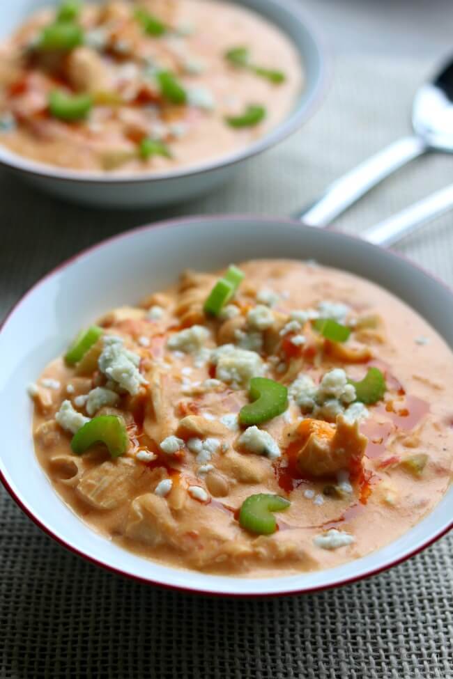 Instant Pot Buffalo Chicken Chili--a creamy white bean chicken chili that is flavored with buffalo sauce and fire roasted tomatoes. It's basically the soup version of buffalo chicken dip.