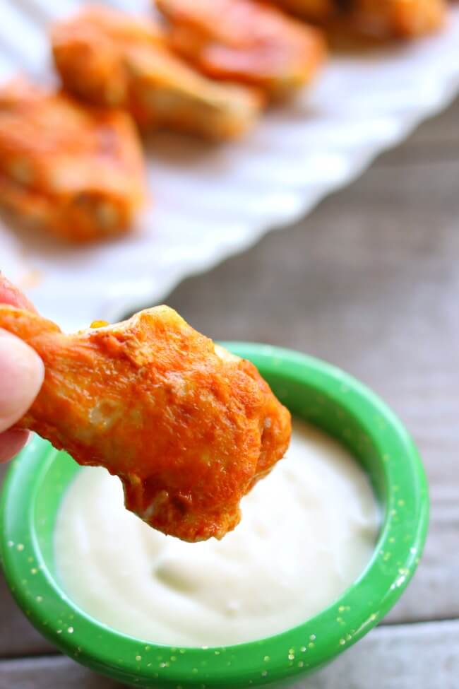 Slow Cooker Buffalo Wings--throw a bag of frozen chicken wings in your slow cooker and walk away for a few hours. Then baste the wings with delicious buffalo wing sauce and broil in your oven for a few minutes and you have super tender and flavorful wings with minimal effort.