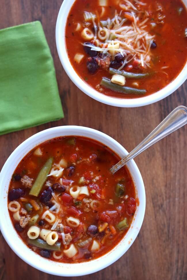 Slow Cooker (Ground Turkey) Minestrone Soup--a colorful, healthy and brightly flavored soup that is full of vegetables, spices, beans, pasta, and ground turkey. Let this soup simmer all day in your slow cooker and enjoy a warm bowl of deliciousness for dinner.