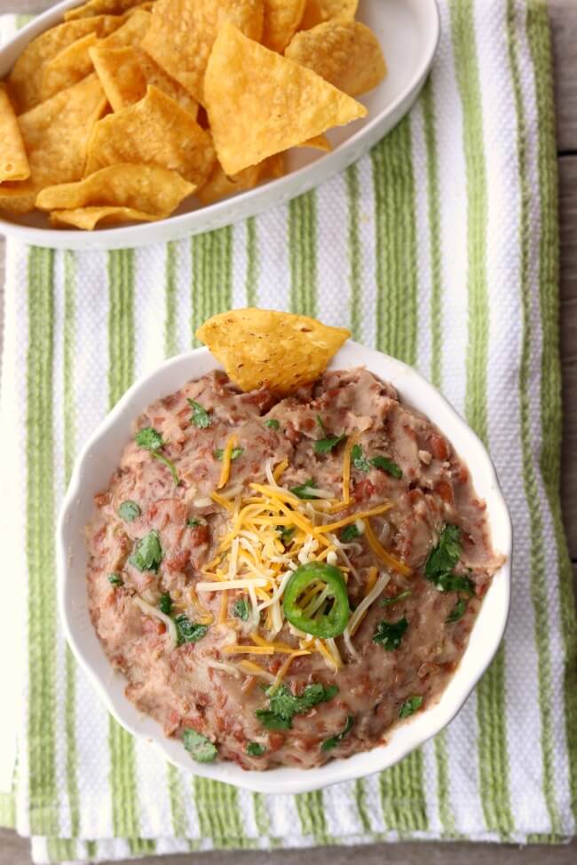 Instant Pot Refried Beans--make your own refried beans from dried pinto beans at home in your electric pressure cooker in just a few minutes. Use in any recipe that calls for a can of refried beans!