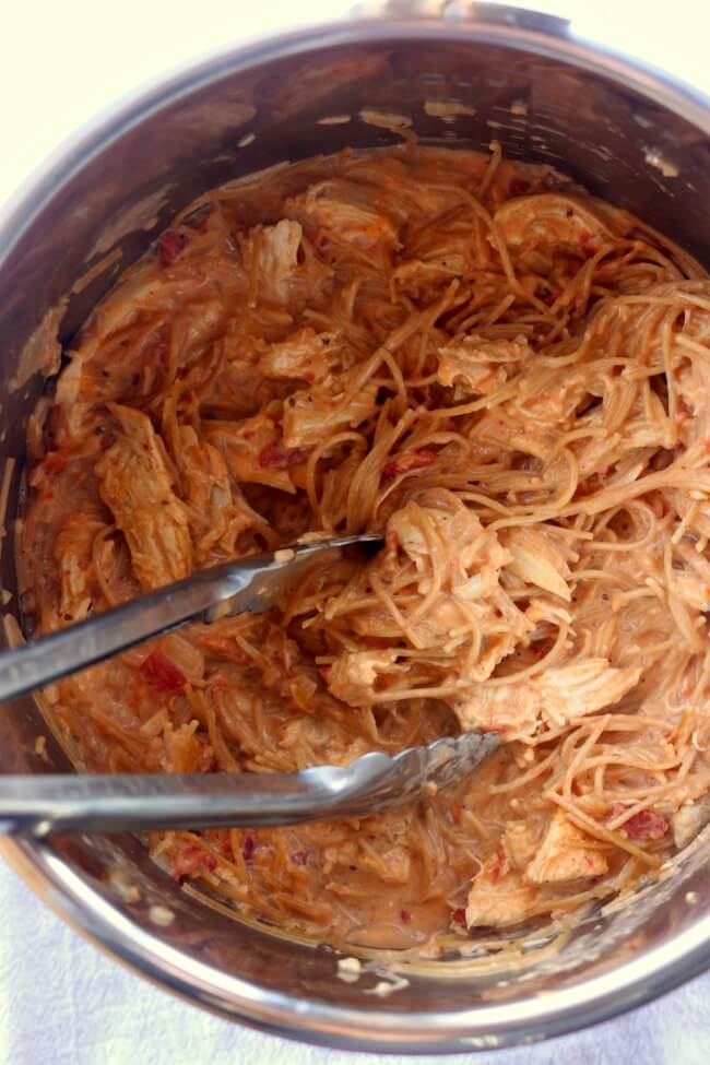 Slow Cooker Chicken Spaghetti--creamy spaghetti with shredded chicken blasted with tons of flavor from seasonings and a can of Rotel.  An easy weeknight dinner that your whole family will love. Get dinner 
