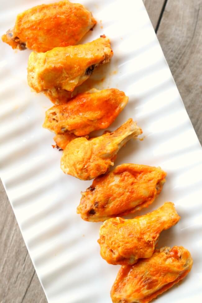 Slow Cooker Buffalo Wings--throw a bag of frozen chicken wings in your slow cooker and walk away for a few hours. Then baste the wings with delicious buffalo wing sauce and broil in your oven for a few minutes and you have super tender and flavorful wings with minimal effort.