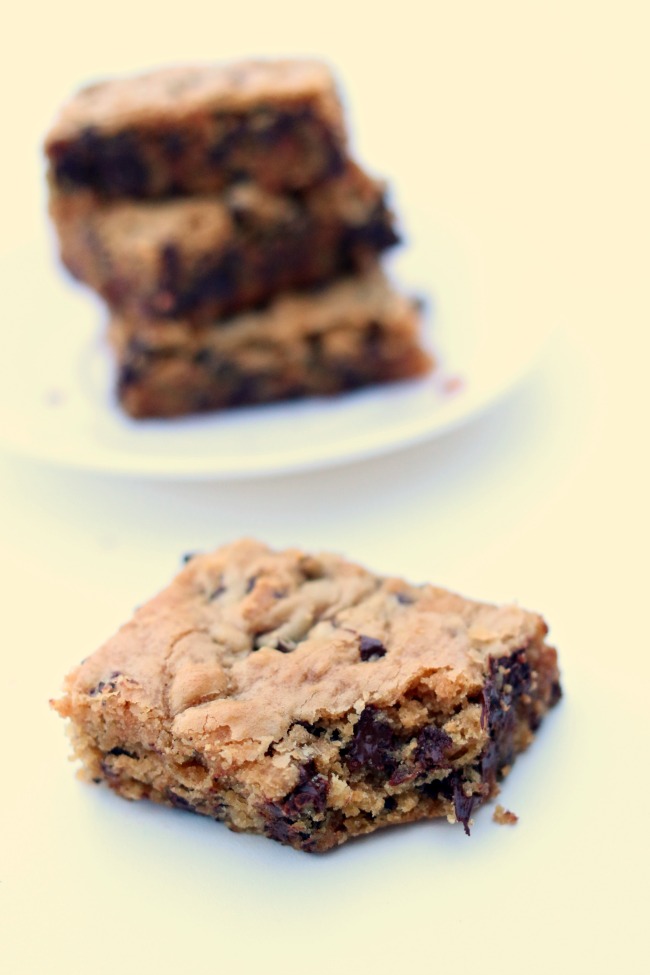 Peanut Butter Chocolate Chip Blondies--peanut butter cookie bars with a plethora of chocolate chips. Eat them while their warm with a scoop of vanilla ice cream or eat them as a snack when their cooled. 