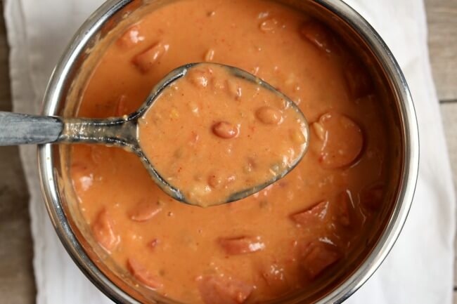 Instant Pot/Slow Cooker Creamy 15 Bean Soup--the classic 15 bean soup recipes with a creamy twist! You're going to love this thick and creamy bean soup with smoked sausage or ham. Make it fast in your pressure cooker or let it simmer all day in your slow cooker. 