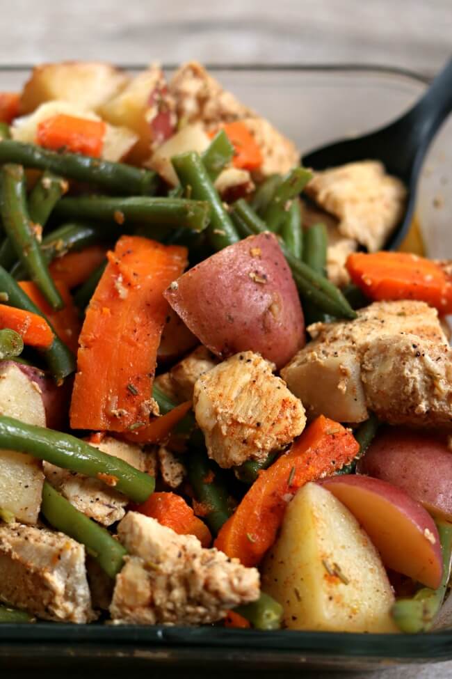 Slow Cooker Homestyle Chicken and Vegetables–well seasoned chicken, green beans, red potatoes and carrots are all cooked together in your slow cooker. A true one pot meal that is family friendly, tastes amazing and is so easy to put together.