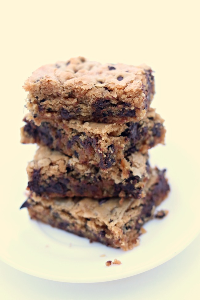 Peanut Butter Chocolate Chip Blondies--peanut butter cookie bars with a plethora of chocolate chips. Eat them while their warm with a scoop of vanilla ice cream or eat them as a snack when their cooled. 
