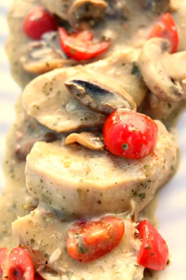 Instant Pot Pesto Mushroom Chicken--tender bites of chicken and mushrooms enveloped in a basil pesto sauce. With only 5 ingredients and the help of your electric pressure cooker you can get dinner on the table in minutes. We like to eat this over orecchiette pasta. 