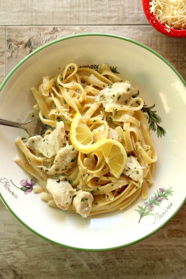 Instant Pot Parmesan Lemon Pasta--a creamy dreamy lemon-y sauce that envelopes fettuccine noodles. You can add chicken breast or leave it meatless, it's up to you. This dinner takes just minutes to make with your electric pressure cooker. 