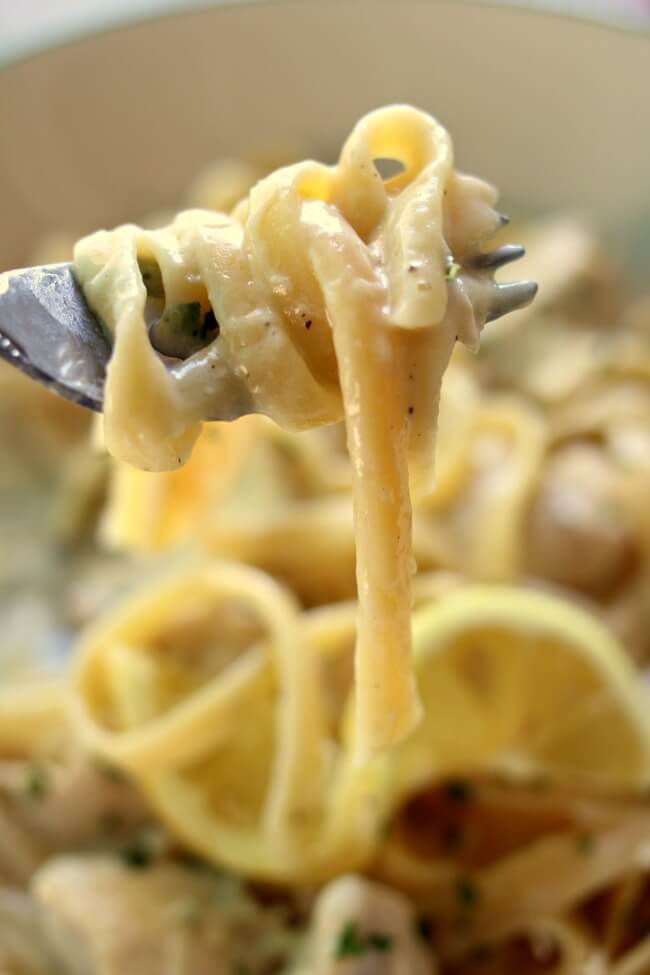 Instant Pot Parmesan Lemon Pasta--a creamy dreamy lemon-y sauce that envelopes fettuccine noodles. You can add chicken breast or leave it meatless, it's up to you. This dinner takes just minutes to make with your electric pressure cooker. 